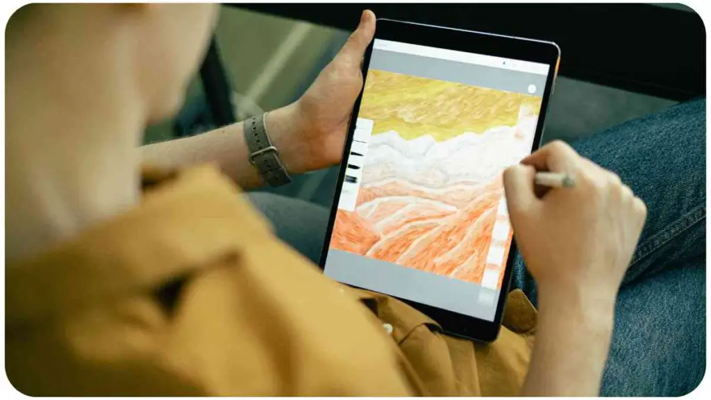 a person is using a tablet to draw on a piece of paper