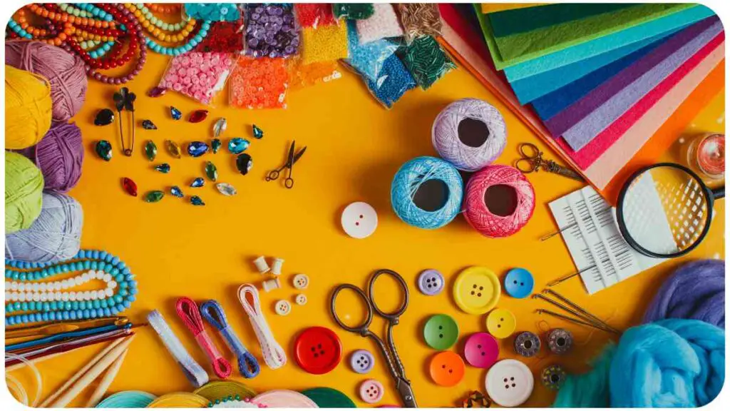various craft supplies laid out on a yellow background