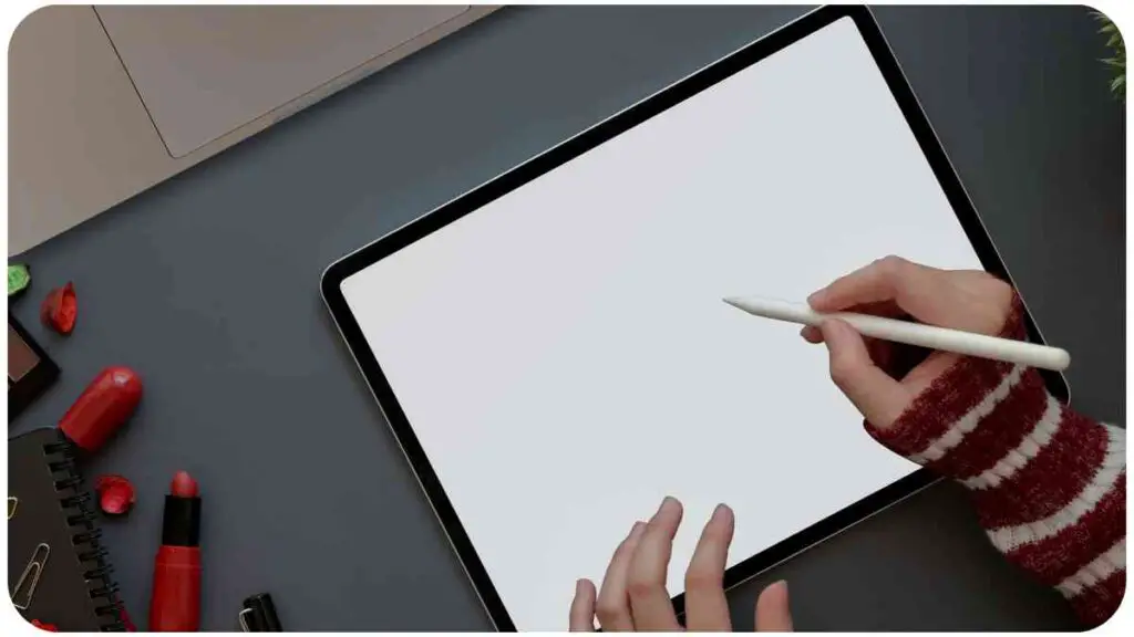 a person is using a tablet with a blank screen