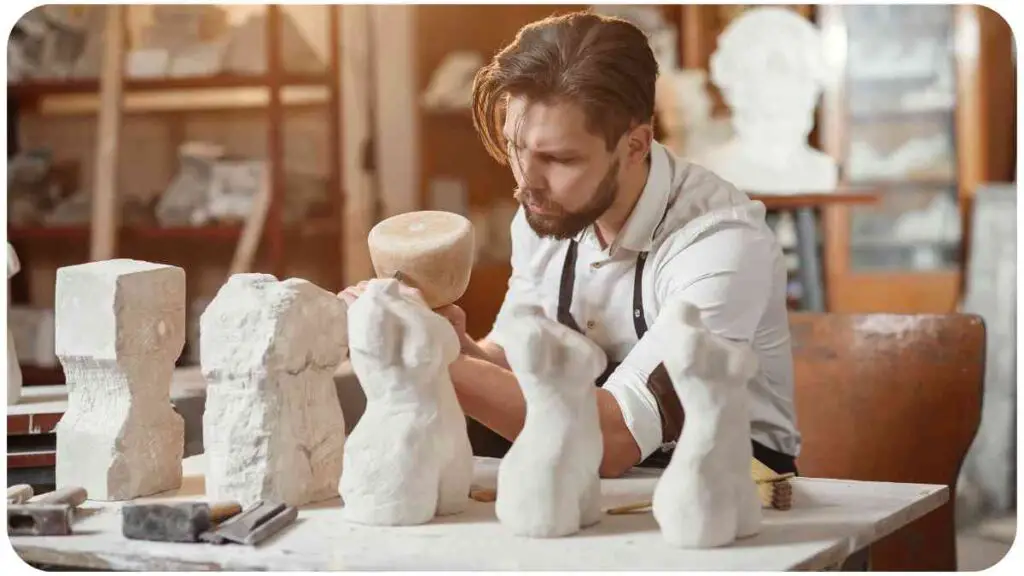 a person is working on a sculpture in a studio